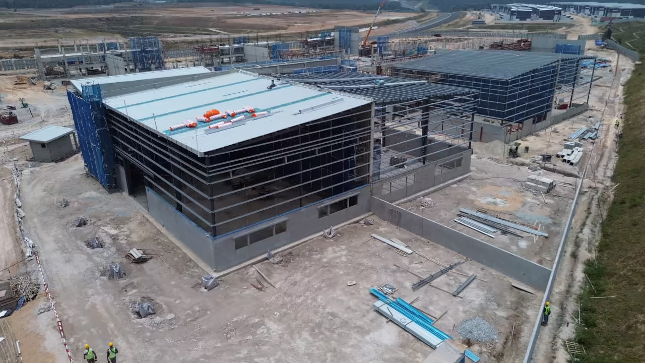 Mild-steel portal-frame factory structure with roof covering